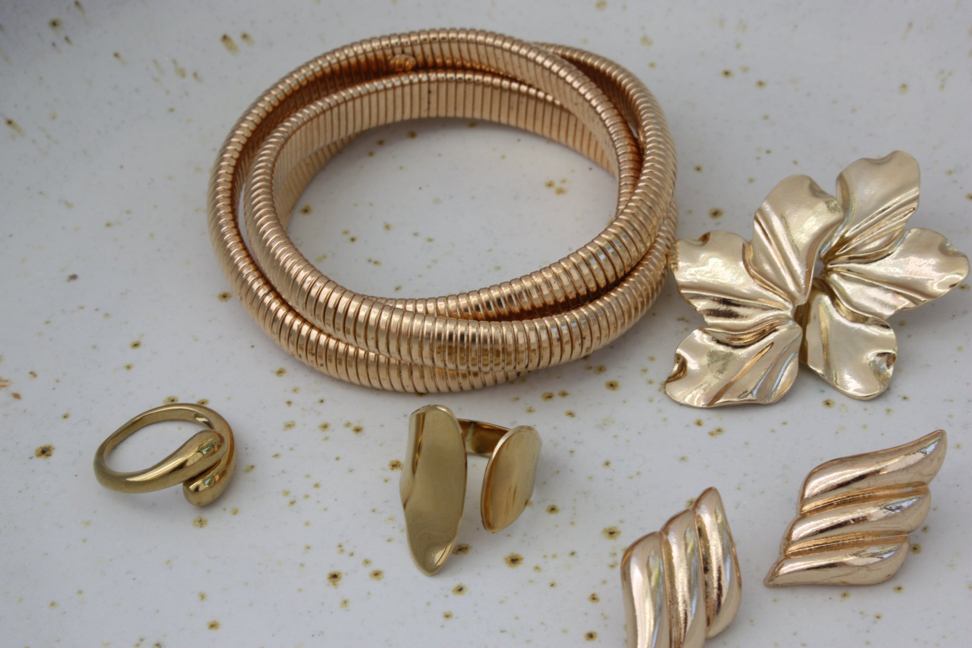 Beautiful Rowe Bangle by ÈRE featured with other accessories, highlighting the versatility of the gold bangle in stylish outfits.